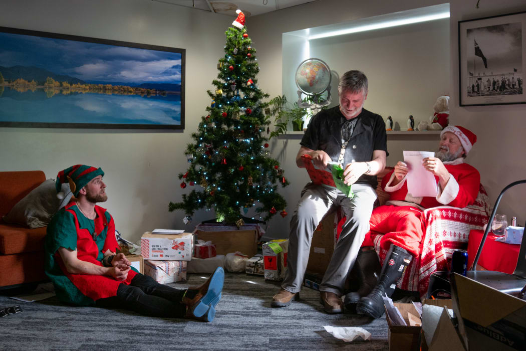 Staff celebrating Christmas at Antarctica's Scott Base share Secret Santa gifts.