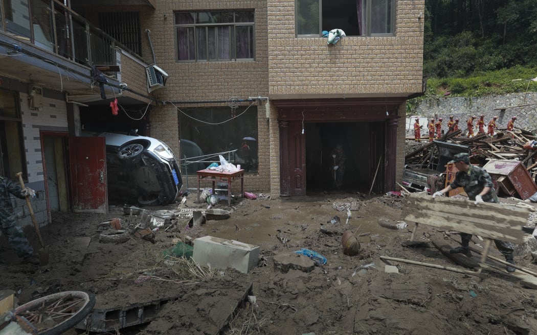 A building hit by a landslide caused by Typhoon Lekima, in Wenzhou city, Zhejiang province, 11 August 2019.