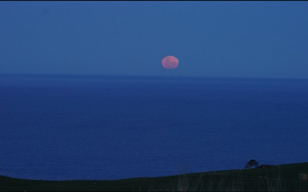 The super blue moon, as seen from Cape Saunders on the Otago Peninsula by Otago Museum director and astronomer Dr Ian Griffin.