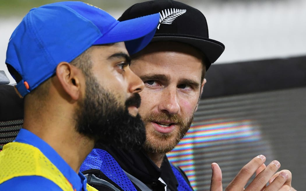 Kane Williamson and India skipper Virat Kohli talk on the side-lines during the fifth and final T20 against India in Mt Maunganui.
