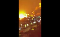 This frame grab made from a UGC video footage of an unknown source posted on social media on July 8 show explosions going off in Iran’s major port city of Bandar Abbas. The United States launched extensive strikes on Iran over attacks on ships in the vital Strait of Hormuz, triggering a wave of reprisals on July 8 that Iran’s Guards said targeted US bases in the Gulf. Both sides reported hitting dozens of targets in renewed hostilities, which have placed fresh strain on an interim deal to end the Middle East war and pushed oil prices to their highest level in two weeks. (Photo by various sources / AFP) /