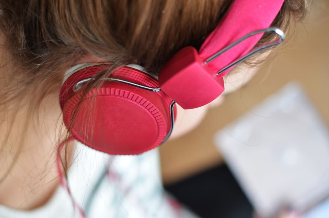 Woman with headphones.