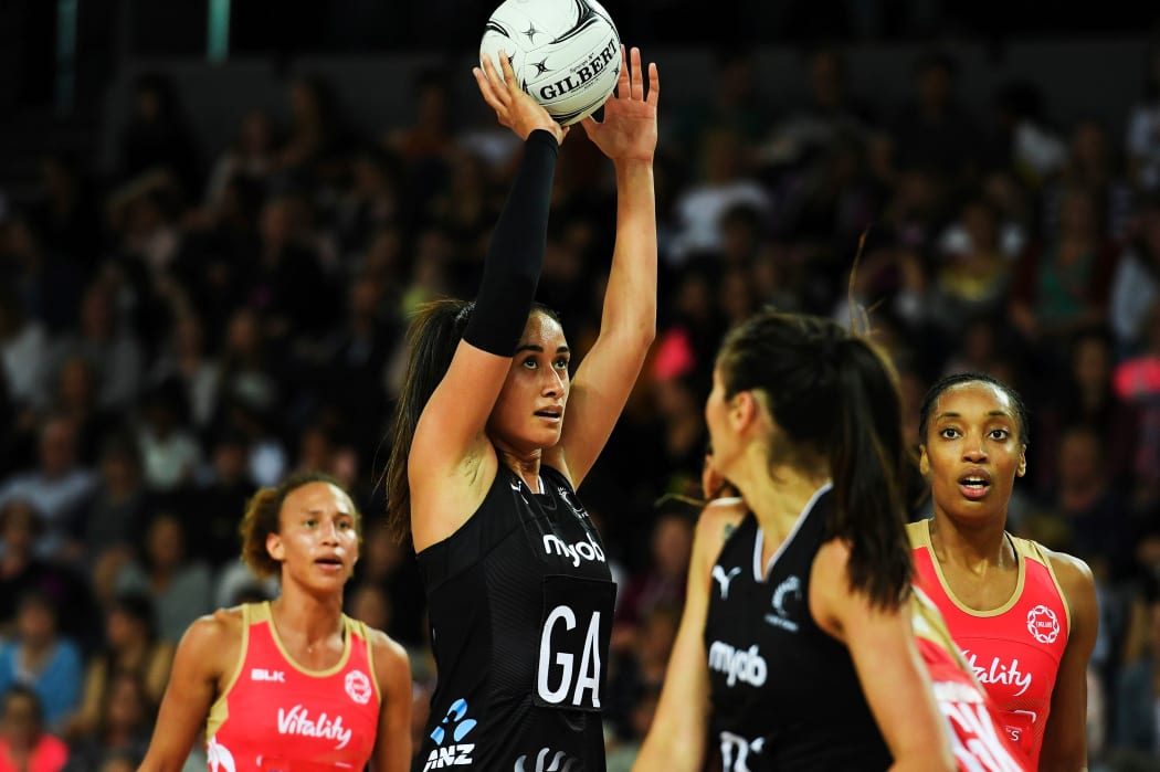 Silver Ferns Maria Folau shoots for a goal  against the England