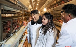 This picture taken on January 7, 2024 and released from North Korea's official Korean Central News Agency (KCNA) via KNS on January 8, 2024 shows North Korea's leader Kim Jong Un (L) inspecting the newly built Gwangcheon Poultry Factory with his daughter Ju Ae (C) in North Hwanghae Province. (Photo by KCNA VIA KNS / AFP) / South Korea OUT / REPUBLIC OF KOREA OUT 
---EDITORS NOTE--- RESTRICTED TO EDITORIAL USE - MANDATORY CREDIT "AFP PHOTO/KCNA VIA KNS" - NO MARKETING NO ADVERTISING CAMPAIGNS - DISTRIBUTED AS A SERVICE TO CLIENTS / THIS PICTURE WAS MADE AVAILABLE BY A THIRD PARTY. AFP CAN NOT INDEPENDENTLY VERIFY THE AUTHENTICITY, LOCATION, DATE AND CONTENT OF THIS IMAGE --- /