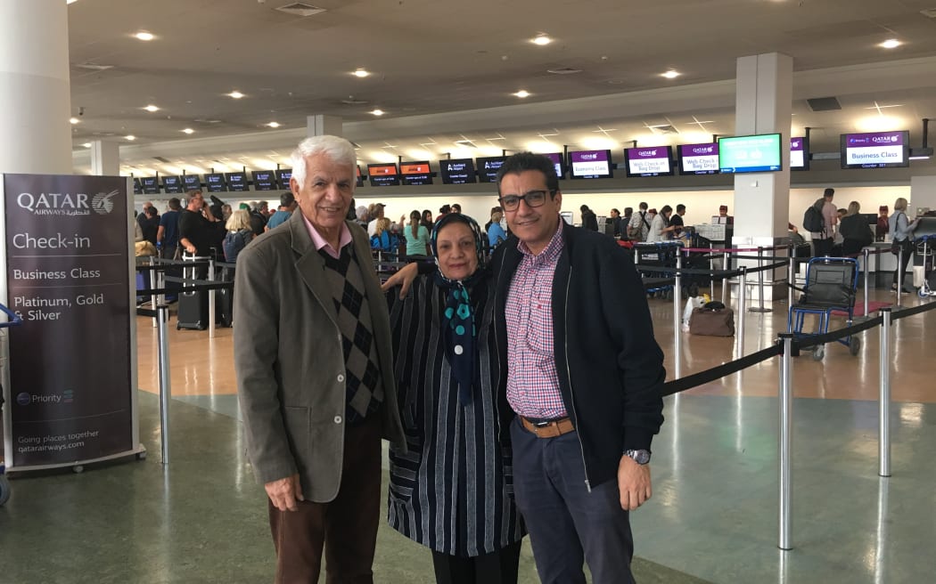 Iranian data analyst Amin Saedi with his parents on their 2019 to Auckland.