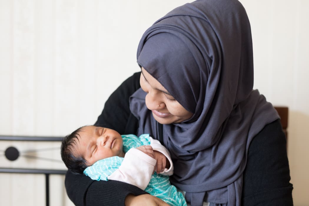Widow Sanjida Neha and her baby daughter Noor e Omar. The father was mosque victim Omar Faruk.