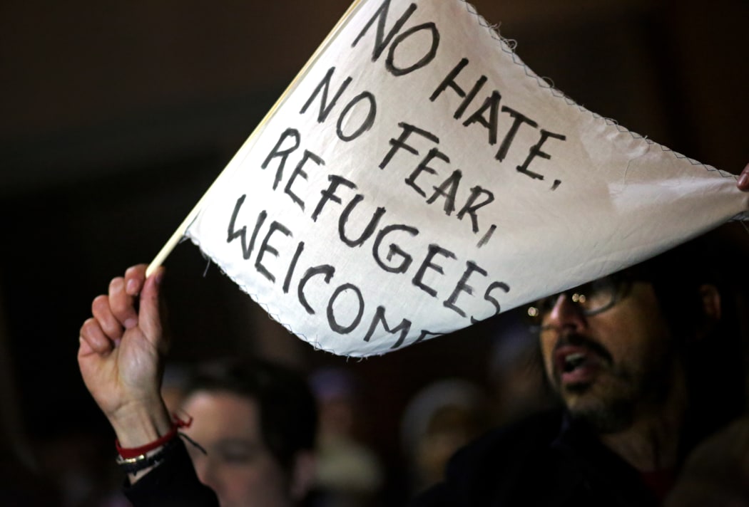 A crowd of protesters gathers outside of the Brooklyn Federal Courthouse as a judge hears a challenge against President Donald Trump's executive ban on immigration from several Muslim countries, on January 28, 2017 in Brooklyn.
