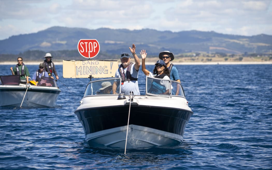 A flotilla of more than 50 watercraft converged from Whangārei Heads to Langs Beach to oppose the proposal to dredge nearly 8.5 million cubic meters of sand over the next 35 years.