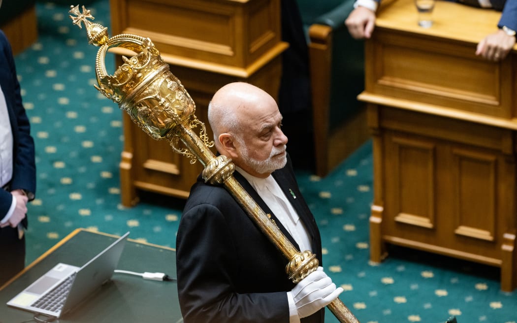 Parliament's Serjeant at Arms Steve Streefkerk holding the mace in the House.