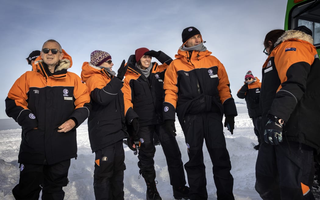 Prime Minister Jacinda Ardern and partner Clarke Gayford with Antarctica NZ chief executive Sarah Williamson, second left, and Antarctica NZ Board chairman Sir Brian Roche, far left, shortly after stepping off the plane on 26 October 2022.