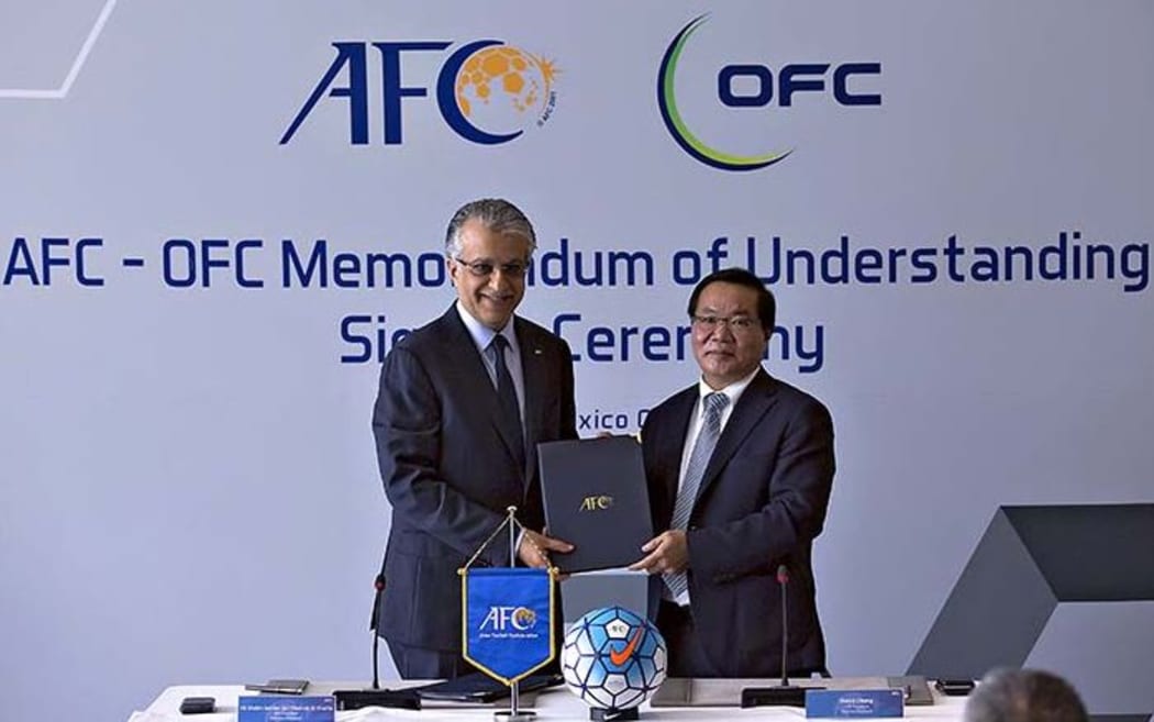 AFC President Shaikh Salman bin Ebrahim Al Khalifa and OFC President David Chung.