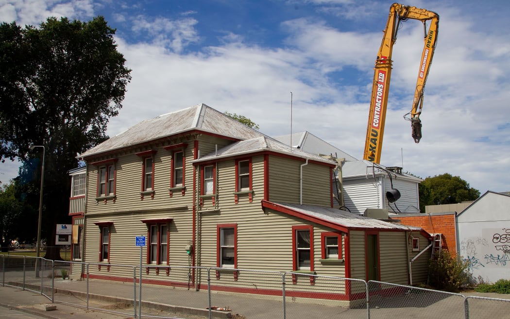 Damaged buildings are demolished in the red zone area in downtown Christchurch on 21 February 2012.
