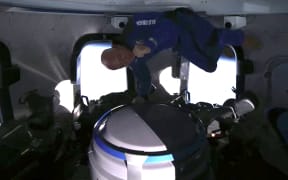 Jeff Bezos celebrating catching popcorn in his mouth during the 20 July 2021, space flight.