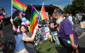 Destiny Church protesters and counter protesters from the rainbow community outside the Gisborne library on 26 March 2024.