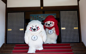 Mascots Ren (L) and G (R) are pictured during a photo session to unveil the official mascots of the Rugby World Cup 2019 in Tokyo