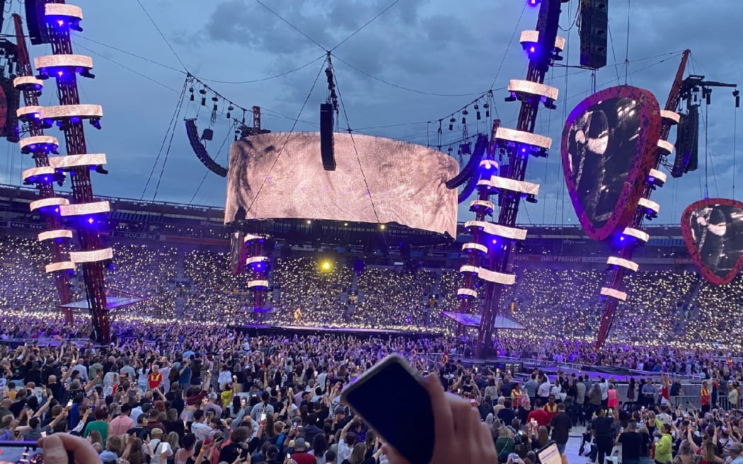 A cellphone is held in the air during Ed Sheeran's Wellington concert.