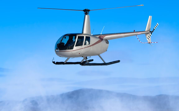 Helicopter flying. Robinson R22 file image.