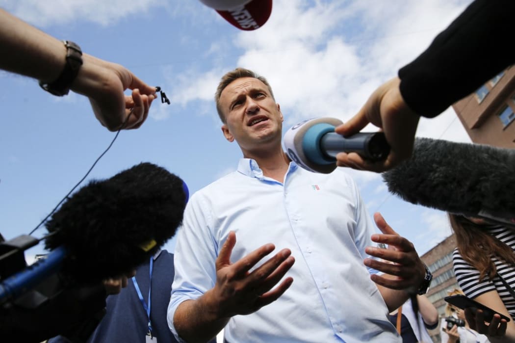 (FILES) This file photo taken on July 20, 2019 shows Russian opposition leader Alexei Navalny speaking with journalists during a rally to support opposition and independent candidates.