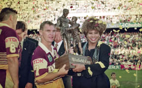 Then Brisbane Broncos captain Allan Langer and Tina Turner with the Winfield Cup trophy in Sydney on 26 September 1993.