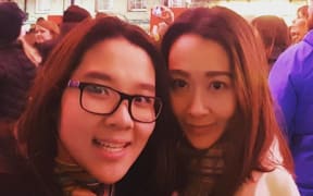 Tharaya Poorisat (left) and her sister Kanwipah Chindaporn.