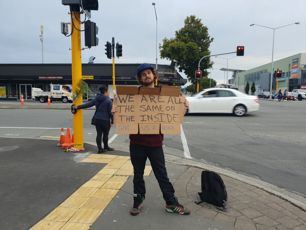 Shay Kenny vows to stand holding his sign for eight hours a day for at least the next week.
