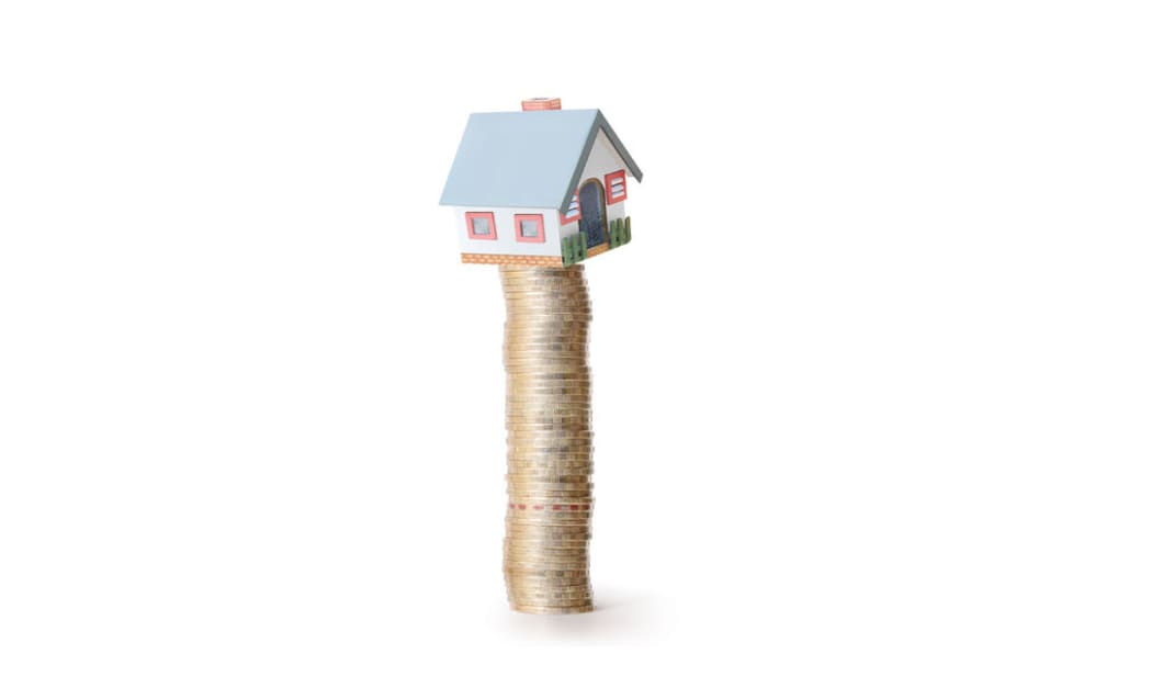 House balancing on money