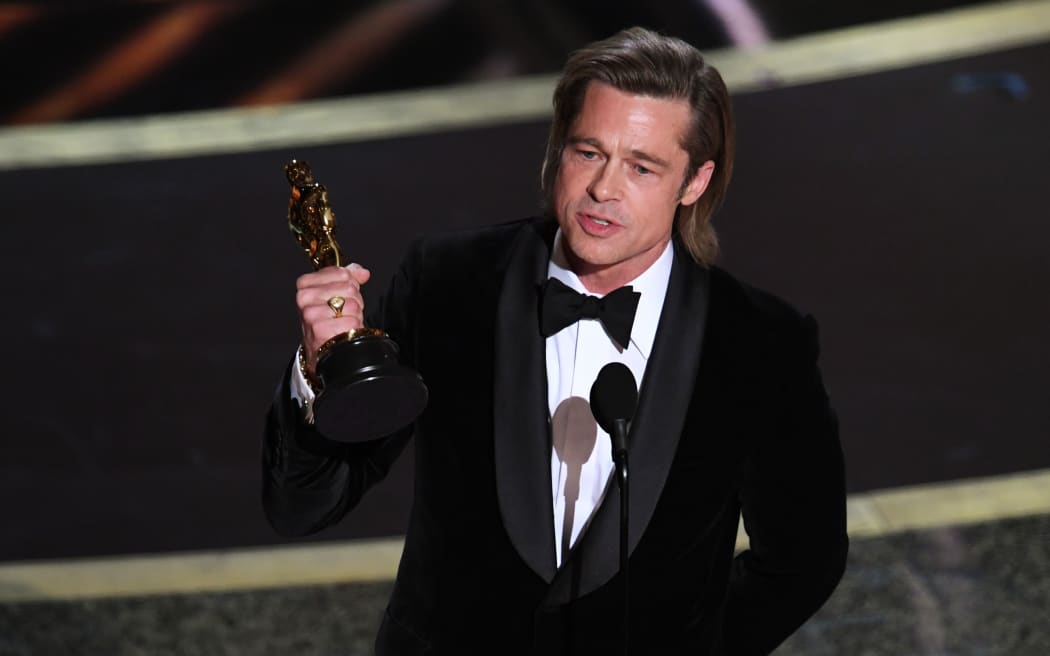 Brad Pitt accepts the Actor in a Supporting Role award for 'Once Upon a Time...in Hollywood' at the 92nd Annual Academy Awards.