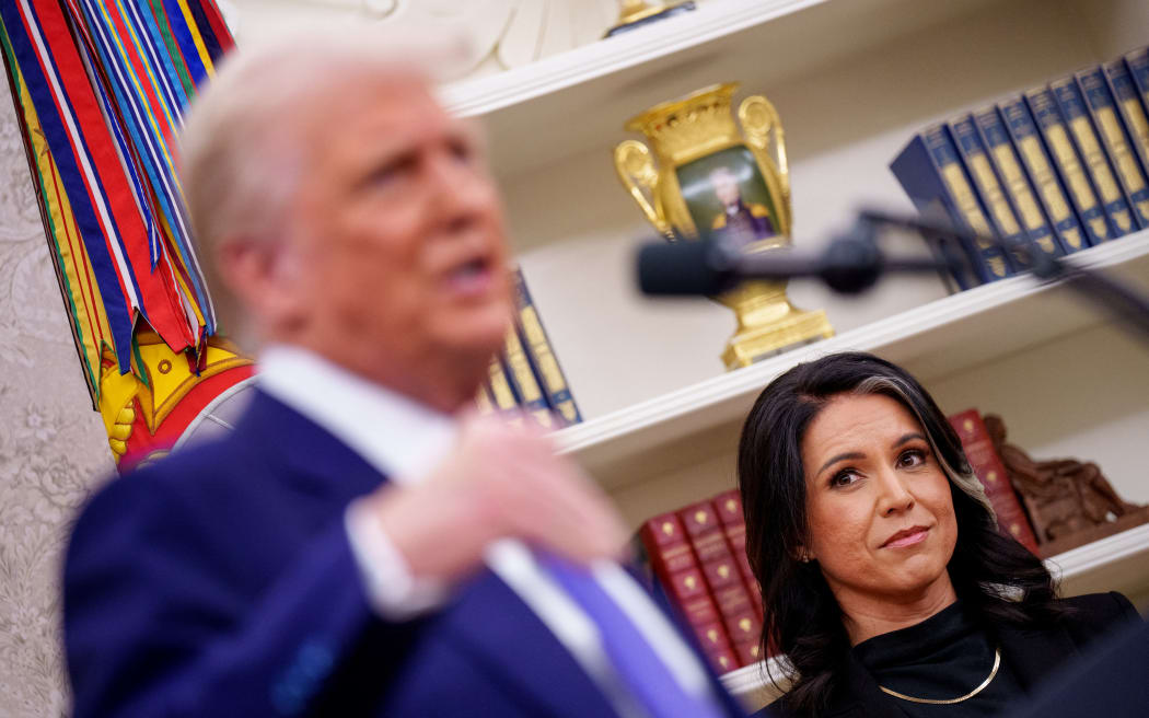 WASHINGTON, DC - FEBRUARY 12: U.S. President Donald Trump, accompanied by Tulsi Gabbard, speaks after Gabbard is sworn in as director of national intelligence in the Oval Office at the White House on February 12, 2025 in Washington, DC. Gabbard, who will oversee the 18 intelligence agencies and serve as Trump's advisory on intelligence, was confirmed by the Senate 52-48.   Andrew Harnik/Getty Images/AFP (Photo by Andrew Harnik / GETTY IMAGES NORTH AMERICA / Getty Images via AFP)