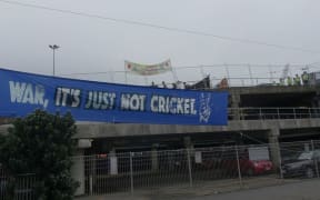 Protesters make their point at the Defence, Industry and National Security Forum at Westpac Stadium in Wellington.