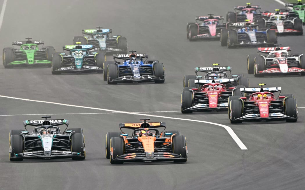 McLaren's Australian driver Oscar Piastri leads during the Formula One Chinese Grand Prix at the Shanghai International Circuit in Shanghai on March 23, 2025. (Photo by HECTOR RETAMAL / AFP)