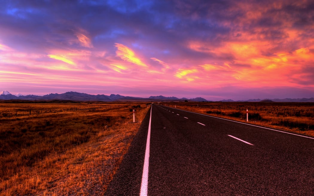 empty country road at sunset
