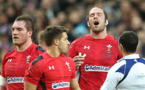 Alun Wyn Jones speaks to referee Jaco Peyper during Wales Six Nations rugby match against France in Paris.
