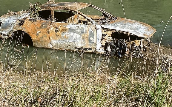 A two-door coupe style vehicle was found in the Tauranga River at Wardlaw Glade