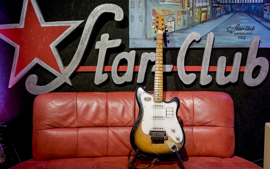 22 May 2019, Hamburg: George Harrison's "Futurama" guitar is on display on a couch in Hamburg's "No.1 Guitar Center" before its auction in London. The Beatles member played this guitar during his legendary guest performances of the band in Hamburg. It is estimated to be worth up to GBP 300 000 (around EUR 343 000) and will be auctioned in London on 12 June. Photo: Axel Heimken/dpa (Photo by AXEL HEIMKEN / DPA / dpa Picture-Alliance via AFP)