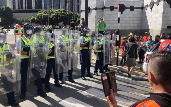 Police with shields on Bowen Street in Wellington.