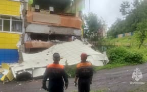 This video grab from a handout footage released by Russia's Emergencies Ministry on July 30, 2025, shows emergency service specialists inspecting a kindergarten damaged by an earthquake in Petropavlovsk-Kamchatskyi. (Photo by Handout / Russian Emergencies Ministry / AFP) / RESTRICTED TO EDITORIAL USE - MANDATORY CREDIT "AFP PHOTO / RUSSIA'S EMERGENCIES MINISTRY" - HANDOUT - NO MARKETING NO ADVERTISING CAMPAIGNS - DISTRIBUTED AS A SERVICE TO CLIENTS