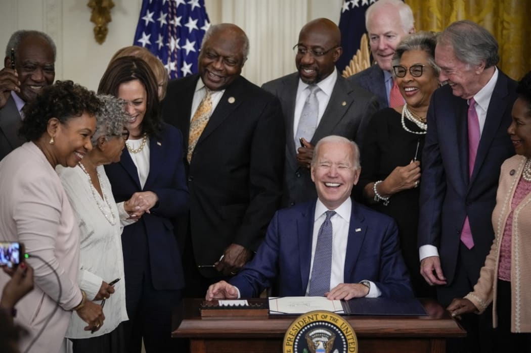 US President Joe Biden signs the Juneteenth National Independence Day Act into law in the East Room of the White House on 17 June in Washington, DC.