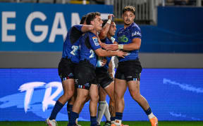 Kade Banks of the Blues celebrates his try with team.