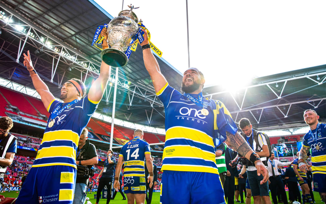 Sitaleki Akauola and Ben Murdoch-Masila celebrate Warrington's Challenge Cup final victory over St Helens in August.