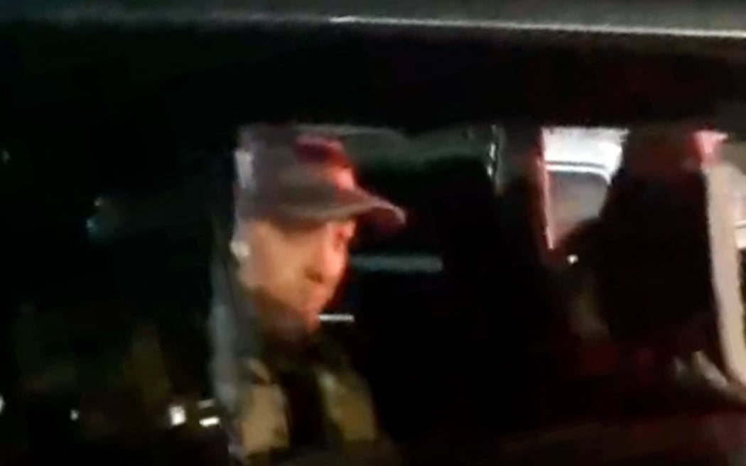 This video grab taken from handout footage posted late on 24 June, 2023 on the Telegram channel @rstv01 shows Yevgeny Prigozhin looking on from a car as he leaves the headquarters of the Russian southern military district in the city of Rostov-on-Don.