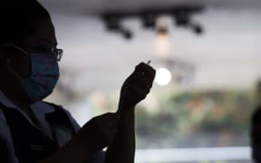 Free application, at the Vasconcelos Library, of the second dose of the Pfizer vaccine against COVID-19, for people from 40 to 49 years who live in the Miguel Hidalgo borough in Mexico City, Mexico, on July 14, 2021. (Photo by Cristian Leyva/NurPhoto) (Photo by Cristian Leyva / NurPhoto / NurPhoto via AFP)
