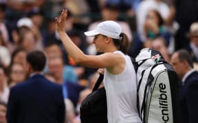 Iga Swiatek of Poland leaves after losing the Women’s Singles Third Round match against Yulia Putintseva of Kazakhstan on the day 6 of the Wimbledon tennis championships at the All England Lawn Tennis and Croquet Club in London on July 6, 2024. ( The Yomiuri Shimbun ) (Photo by Takuya Matsumoto / Yomiuri / The Yomiuri Shimbun via AFP)