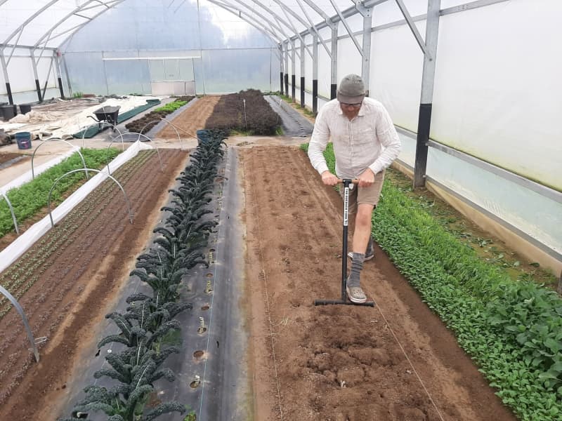 Callum Mclean working the soil.