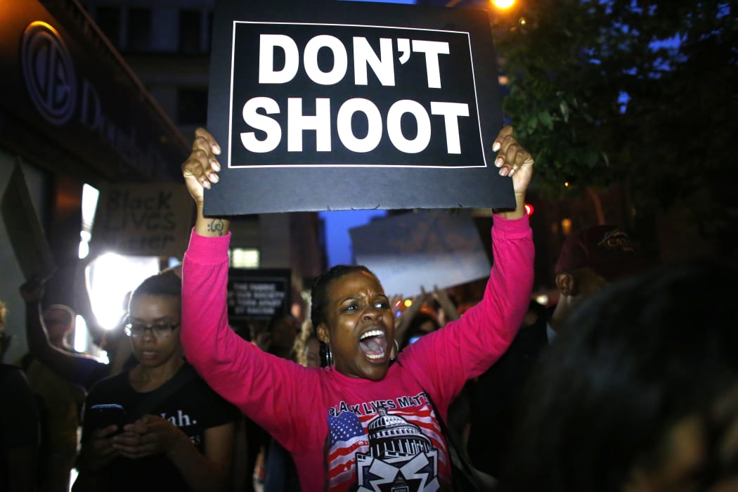 A woman holds a banner during a protest in support of the Black lives matter movement in New York.