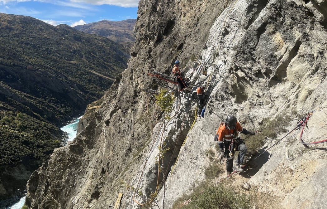 The crews look down on the Kawarau River while setting up rigging for the drills