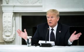 US President Donald Trump speaks during a roundtable in the State Dining Room of the White House on 18 May, 2020 in Washington, DC.
