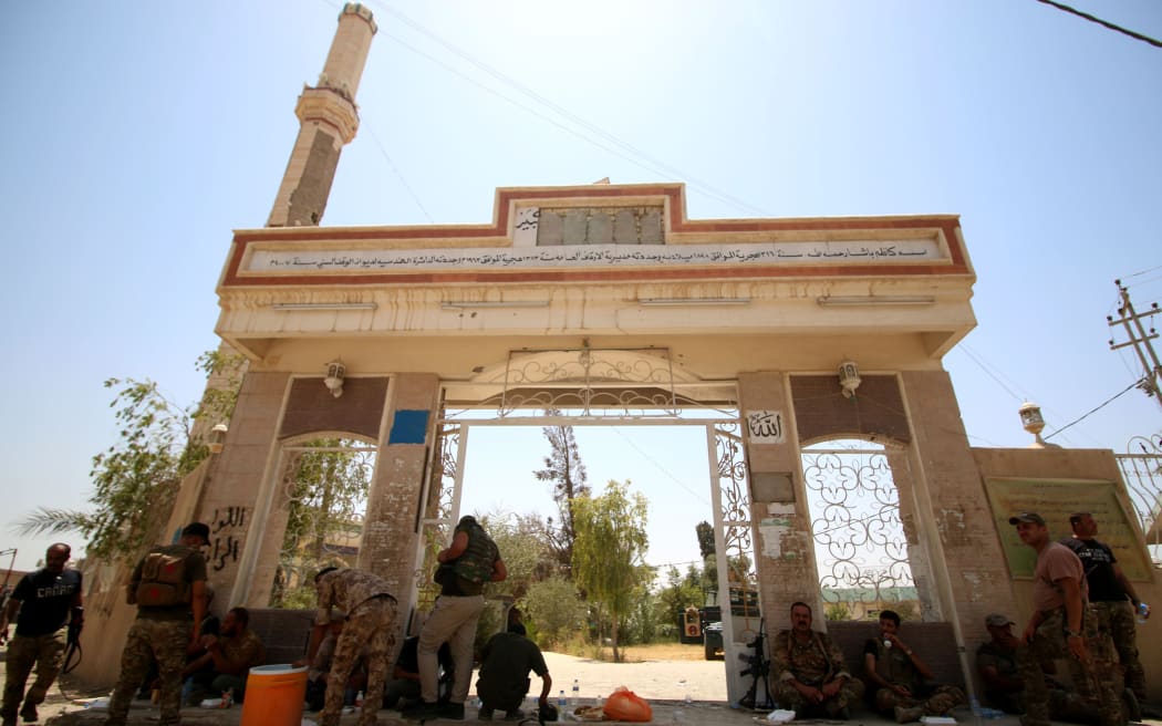 Iraqi government forces are seen in Fallujah, 50 kilometres (30 miles) from the capital Baghdad, after they retook the embattled city from the Islamic State group on June 26, 2016. I