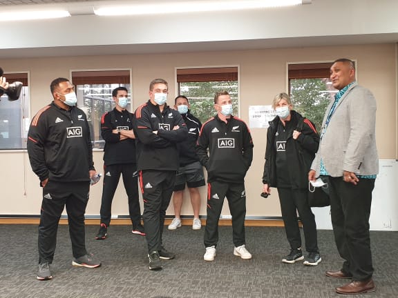 All Blacks players talk with South Seas Health chief financial officer Mark Croker