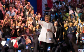 Democratic presidential candidate Hillary Clinton arrives onstage to deliver her victory speech.