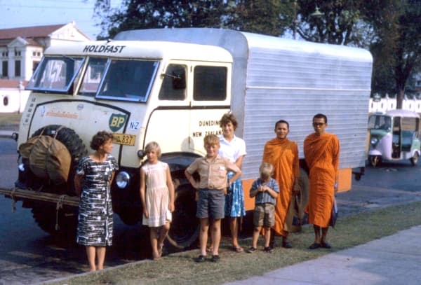 Five of the MacLeods with monks in Bangkok.